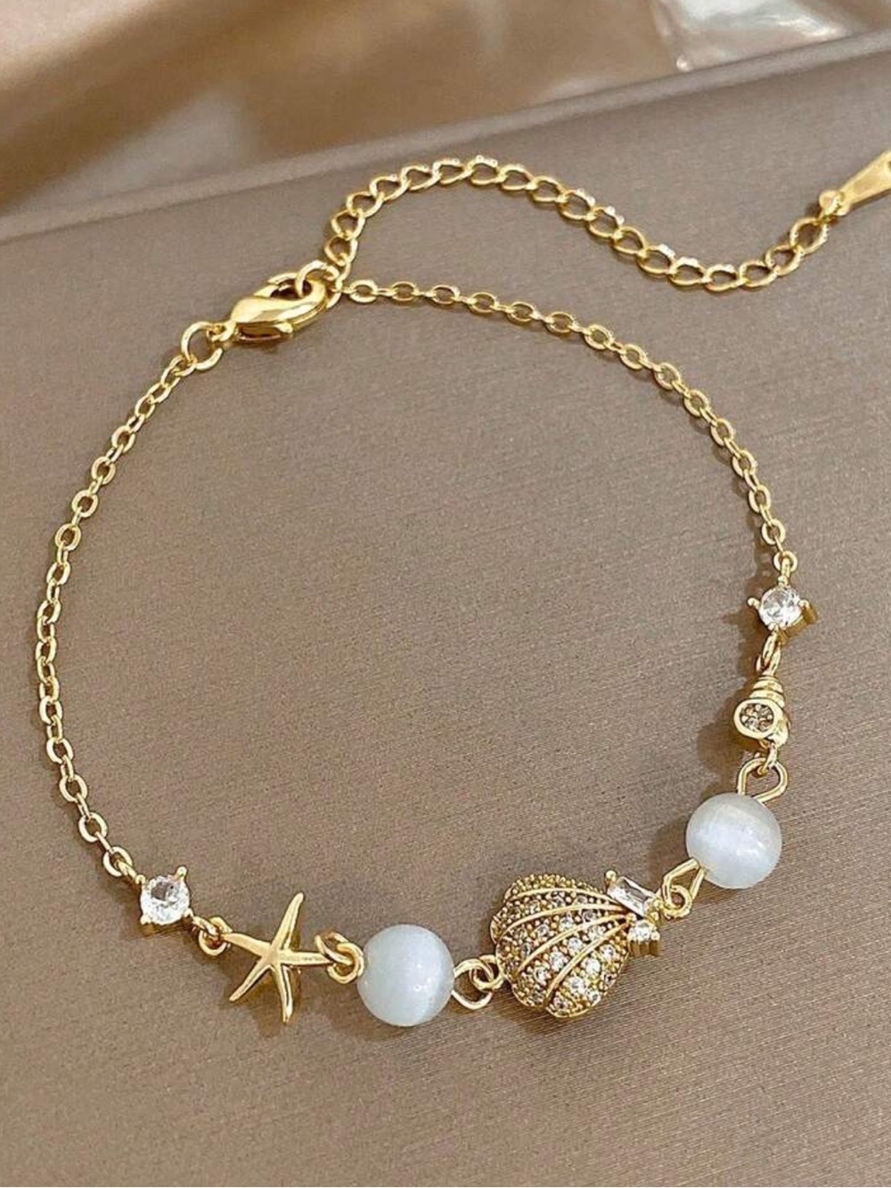 Gold Seashell & Star Charm Bracelet with White Beads
